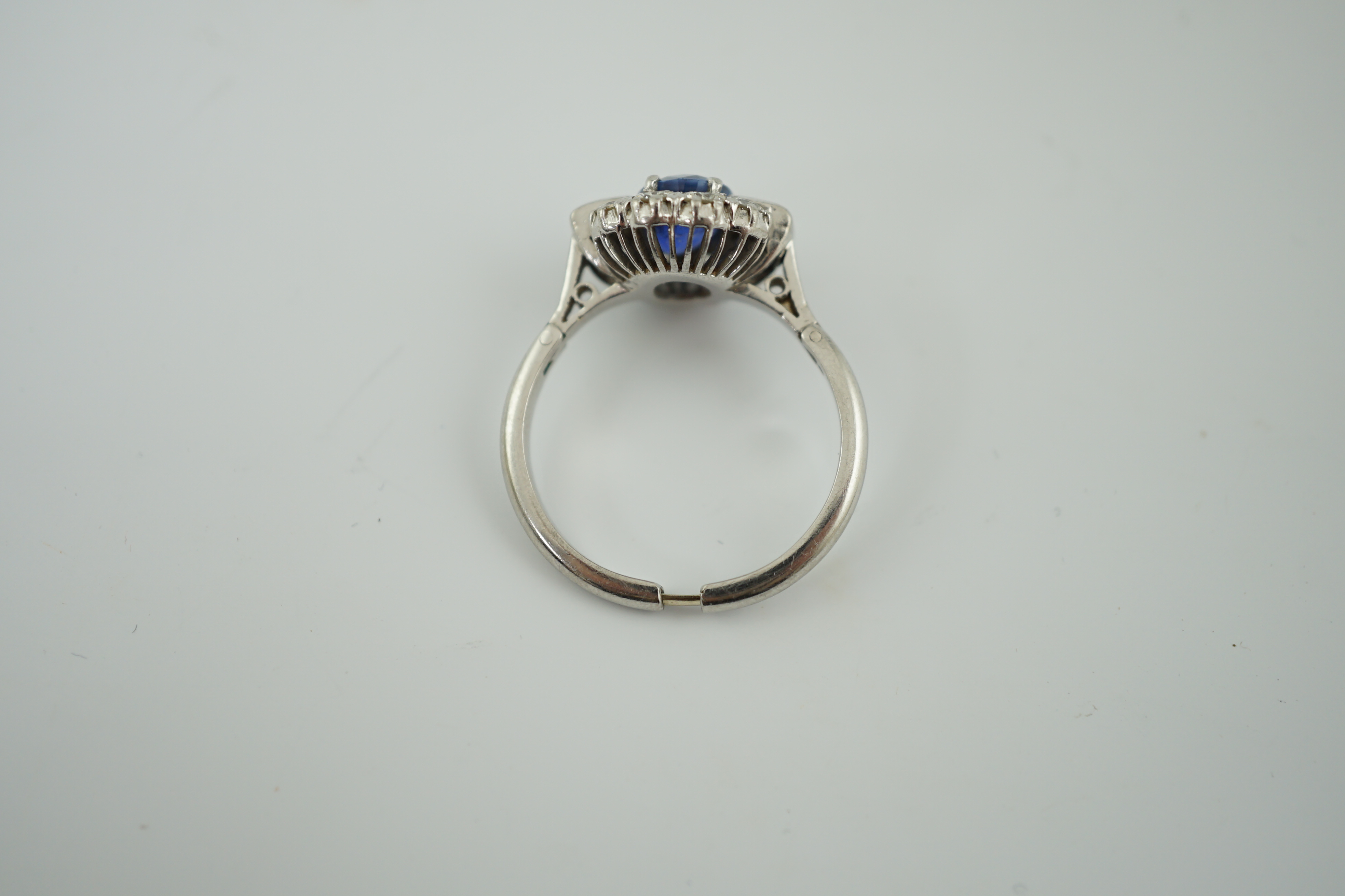 An Art Deco style platinum?, sapphire and diamond cluster ring